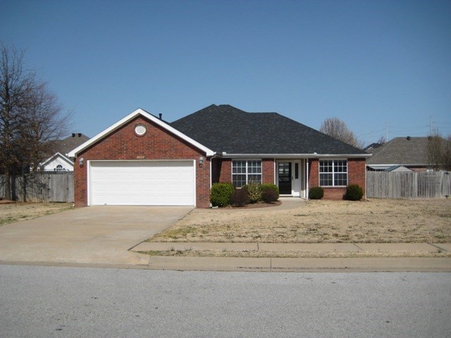 4 bed & 2 bath house in Springdale with a 2 car garage! Fireplace, covered back deck, & privacy fence!
