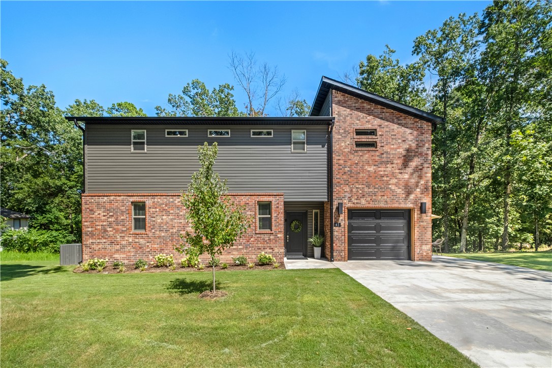 Just minutes from Lake Park and the Back 40 Trails - Don't miss this prime Bentonville home --perfect for outdoor enthusiasts! 2 bed 2.5 bath with 1 car garage.  This "Like New" home features open kitchen layout with beds and laundry upstairs.  Extra driveway parking and backs up to a common area leading to Lake Ann. Great for an AirBnB - rental history available.