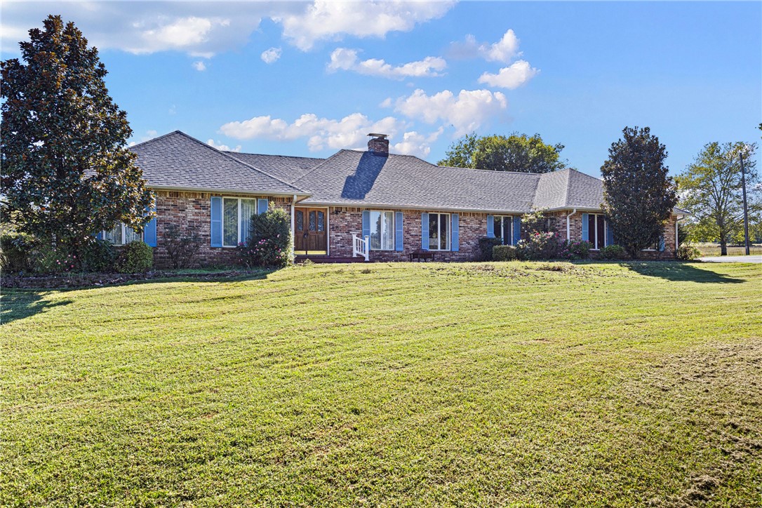 Welcome to your dream countryside estate! This expansive property offers approximately 2904 sq. ft of comfortable living space, nestled on an impressive 27.80 acres of beautiful pasture. A circular drive welcomes you home where you will find plenty of charm and functionality throughout. The kitchen features Jenn-Aire stovetop and a separate grill, granite countertops, a new oven with above oven microwave in 2023, wet bar with micro fridge, trash compactor and plenty of storage. The property has three wells, one of which is an artesian well, including rural water to house, a 40X50 barn, 30X50 shop built in 2021 with a three-car garage. The Generac whole house generator and Geo-Thermal system with permanent hepa filters were installed in 2023 making this home energy efficient. Along with the ADT security system, it's a self-sufficient retreat that combines comfort and rural beauty - come see it for yourself.