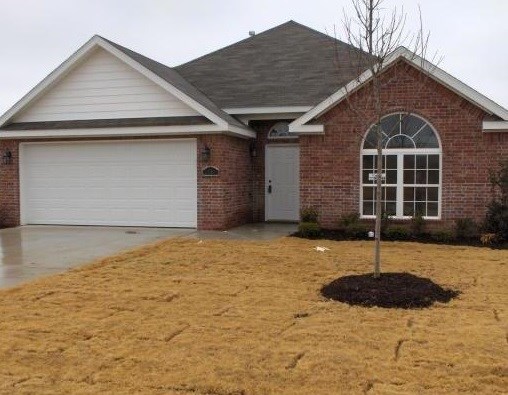 Charming brick home, gas log fireplace, vaulted ceilings & crown molding.