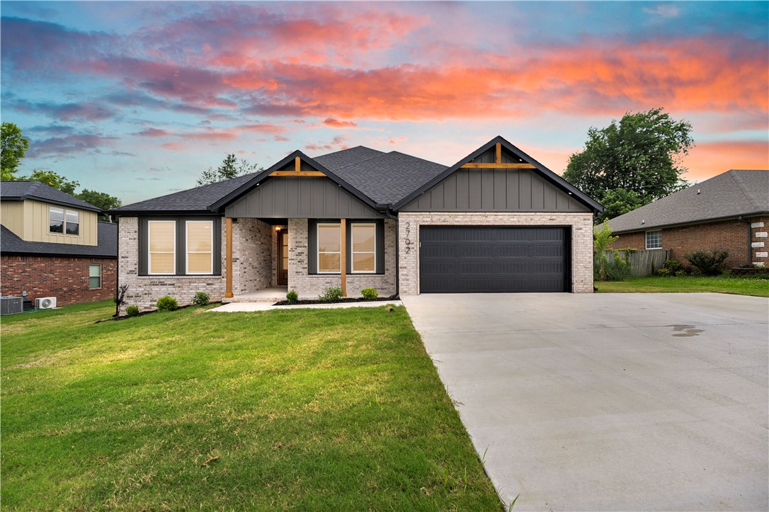 Welcome to 2702 Cortney Circle, where timeless design meets modern everyday living. This thoughtfully crafted 4 bedroom, 3 bath home offers 2,297 square feet of beautifully designed living space, blending modern transitional style with warm farmhouse charm. From striking brick exterior, cedar accents, designer lighting to custom cabinetry, statement fireplace, and a spacious open-concept layout. Every detail has been carefully selected to create a home that is both elegant and functional. The heart of the home features a generous kitchen with custom two-tone cabinetry, dream pantry with built ins and a coffee nook. The split bedroom plan provides privacy from the primary suite while also offering a secondary suite with a full bath. Just minutes from historic Downtown Siloam Springs, boutique shopping, City Lake Park, and the Sager Creek Trail, you'll also appreciate the convenient drive to JBU, schools, medical facilities, and HWY 412 for an easy commute throughout NW Arkansas.
