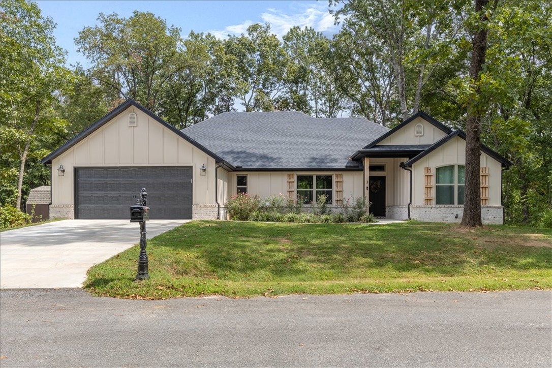 Wow! Check out this almost new home on the Bentonville/Coler Preserve side of Bella Vista! Get the best of both worlds with this location-Downtown Bentonville 15 min & short hop to hiking, biking, lakes & all Bella Vista has to offer. This Aaron Nickell built home offers a smart floor plan w/2 bedrooms PLUS a 14 1/2 x 11 office/flex room, & a separate library/den w/moody green paint, built-in shelves & barn doors-use it however you'd like! Open floor plan w/full view windows in main areas, 12x24 inch tile & wood floors (NO CARPET) 10 ft, tray & vaulted ceilings, spacious kitchen w/prep island, built-in oven & microwave, walk-in pantry & upgraded tile backsplash. Large primary suite w/10x14 bath featuring double vanity, soaking tub & 3x4 walk-in shower. HUGE 14x7 walk in closet. Upgraded wide trim & molding. 18 1/2 x 6 covered back porch, pet ready LEVEL fenced yard, Generac generator hookup & level drive w/room for 4 cars. Lovely exterior finishes, sharp black roof & gutters & 10x6 covered entry. So much to love!