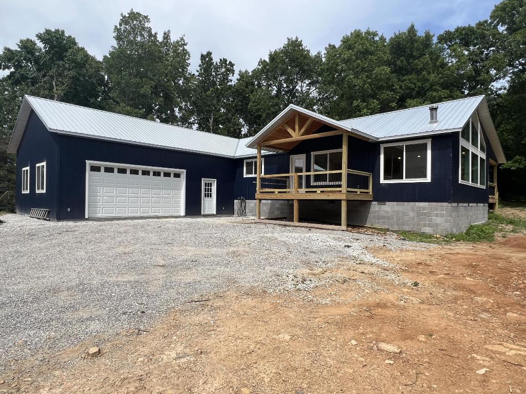 Brand NEW Construction with 4 BR, 3 BA, 1,920 SQFT, CH&A, 2 car garage, 2 covered porches, and 3.50 wooded acres m/l. The home features a large great room with wood stove, two jetted tubs, cathedral ceilings, large windows, metal roof, rural water, private master bedroom deck, and over sized garage.  If you are looking for a new home with land this is one you ought to take a look at.  Schedule a viewing today!