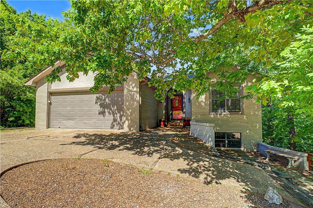 Wake up to panoramic views of Kingswood Golf Course in this stunning 4 bedroom, 3 bath home perfectly positioned just a stone’s throw from the Little Sugar Bike Trail. If location matters, this one delivers—golf, mountain biking, and the center of town are all just minutes away.
Designed for both everyday comfort and unforgettable entertaining, this home features two wood-burning fireplaces and a lower level built for gathering, complete with a bar and easy access to outdoor living spaces. Enjoy three levels of decks that maximize the breathtaking views. Soak in the hot tub under the stars, host game days with two outdoor TVs, or relax year-round on the screened porch.
Whether you're sipping coffee overlooking the fairway or entertaining friends after a day on the trails, this property captures the best of Bella Vista living. Washer, dryer, refrigerator, hot tub, and two outdoor TVs all convey—making this an exceptional opportunity to move in and start enjoying immediately.All new carpeting and bathroom flooring!