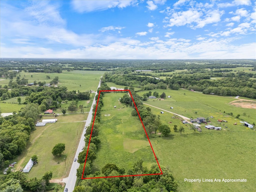 10.66 acres with extensive Highway 12 frontage in Northwest Arkansas, offering strong visibility and access with endless potential. If you’ve been waiting for the right investment opportunity in Northwest Arkansas, this property is positioned in the fast-growing Highfill area, just minutes from the upcoming 612 interchange near XNA. With quick access to I-49, you can reach Bentonville, Rogers, and other major Northwest Arkansas cities in under 30 minutes. Currently utilized for animal farming, the true value lies in its development potential. The property lends itself well to a variety of uses including multi-family development, an RV park or tiny home community, storage units or flex space, commercial frontage, short-term rental cabins, or a mixed-use concept. With growth expanding in this direction and infrastructure improvements underway, this is a prime opportunity to secure land in a high-growth corridor.