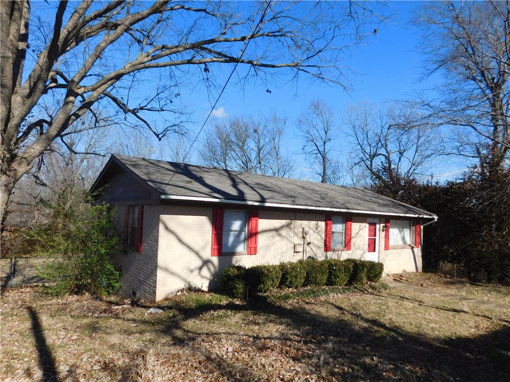 Neat brick home in a great location, close to schools, parks, shopping, UofA, and I-49. This sweet home is at the end of a cul-de-sac, has a fenced back yard, extra storage room, nice sized bedrooms, and the refrigerator conveys to Buyer. Check it out. Lots of extras. One of the absolute best deals in Farmington!