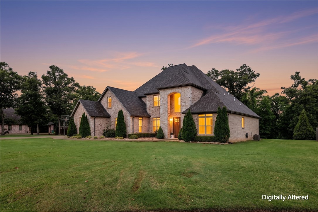Experience the prestige of Versailles from this exceptional custom home situated on 1.84 private acres. Offering 4,966 square feet of living space, this home balances elegance, comfort, and versatility. The chef’s kitchen is the heart of the home, featuring two oversized islands, top-of-the-line appliances, abundant cabinetry, and ample space for entertaining. The open-concept layout flows into a cozy living room with a gas fireplace, while a second living area with its own gas fireplace provides additional space to relax and gather. The main level includes a luxurious primary suite and an en-suite guest bedroom.  Upstairs, you'll find a spacious lounge opening to a private patio and a media/flex room offers endless possibilities to suit your needs.  Enjoy luxury living on a quiet cul-de-sac with convenient access to Northwest Arkansas' major employers, schools, dining, shopping, and all the amenities the region has to offer. *seller is offering a 1% incentive towards buyers closing costs with preferred lender*