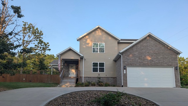 Built in 2022, this beautiful 3 bedroom, 3 full bath home sits on nearly half an acre on a secluded, level lot in Bella Vista, just minutes from the Back 40 Trail system, shopping, dining, and schools. The open floor plan offers abundant natural light, luxury vinyl plank flooring, and a propane gas fireplace. The kitchen features granite countertops, stainless steel appliances, a walk-in pantry, and a spacious dining area. The main-level primary suite includes dual vanities, a soaking tub, a walk-in tiled shower and a large walk-in closet. The back yard features a covered patio to enjoy in the privacy fenced backyard.  This well-maintained home offers a functional layout, modern finishes, attic storage and large additional room area over the garage that could be used as an extra bedroom/guest room, office space or theater room.