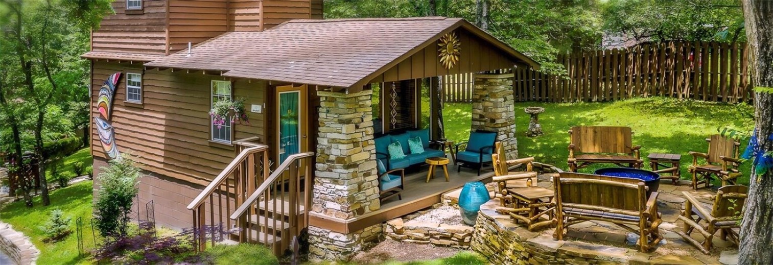 The Woods Cabins is a lodging property with five cabins, comprising 5 individual guest units within a short walk of downtown Eureka Springs, AR.  Located on close to an acre of pristine and well manicured property, the Woods Cabins is a 5 star resort with impressive accommodations including inside the units and on the grounds. The owners have thought of every little detail to please guests in each unit. The owners chose the finest of everything, from the outdoor lighting and seating to the microwave, small stove and coffee makers in the charming kitchenettes.  Heated bathroom floors, wood floors, whirlpool tubs, private decks and patios and beautiful furnishings throughout are just a few outstanding features at The Woods Cabins.  These cabins provide a fantastic place to stay while visiting Eureka Springs. Hardly any other property in the city combines both the rustic luxury, private setting “in the woods” yet just a few short minutes’ walk down the hill to downtown.