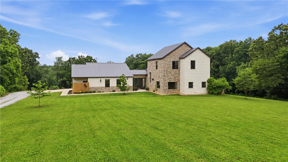 This one-of-a-kind custom farmhouse was designed and built by the owner himself, a professional custom home builder, and every detail reflects that expertise. Situated on 4.66 acres with trees on three sides and a generous setback from the road, the property offers a rare level of privacy and seclusion that is increasingly hard to find.

The construction quality here goes well beyond standard. The entire first floor exterior is built with cement and rebar, meeting Florida code standards for structural integrity and storm resistance. The primary bedroom features a dedicated storm shelter built directly into the "his" closet, protection that is always within reach. The second floor is framed with 2x8 studs throughout, providing superior strength and insulation capacity over typical construction.

Whether you are a builder who appreciates the craftsmanship or a buyer looking for a home that is truly built to last, this farmhouse delivers on every level.