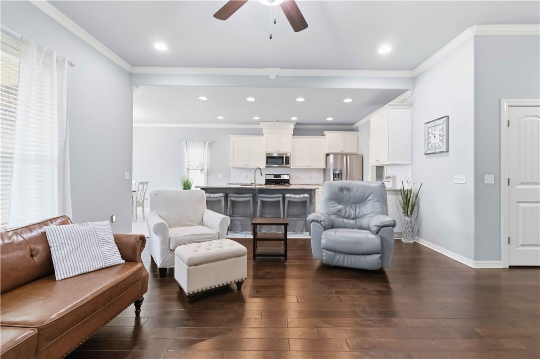 Move-in ready and perfectly positioned in one of Northwest Arkansas's fastest-growing communities, this beautiful 4-bedroom home combines modern style with everyday functionality. Bright, open living spaces create an inviting atmosphere that's ideal for both relaxing and entertaining. The kitchen and bathrooms showcase granite countertops and beautiful backsplashes, adding a fresh, contemporary touch throughout the home. Step outside to an extended patio with a gazebo—an inviting outdoor retreat perfect for hosting friends, weekend barbecues, or unwinding at the end of the day. With a thoughtfully designed layout, this home offers comfortable living in an established neighborhood just minutes from Bentonville schools, shopping, dining, and parks. To make your move even easier, the seller is offering up to $5,000 toward buyer closing costs, plus up to $3,000 in lender credits through the preferred lender.