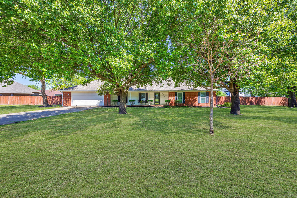 Delightful home in the Bethel Heights Subdivision! Functional floorplan with flexible living spaces boasts a functional office, cozy art room and beautiful sun room. Vaulted ceilings and gorgeous natural light pours throughout the home. Spacious bedrooms for everyone with primary offering tray ceilings, walk-in closet and dual sink vanity. Large fenced backyard with a spacious deck, above-ground pool, pole barn and storage shed providing ample space for outdoor use and storage. Located in established neighborhood at end of culdesac. Close to schools, park and trails with easy access to 71-B and I-49. This one is move-in ready and waiting for you!