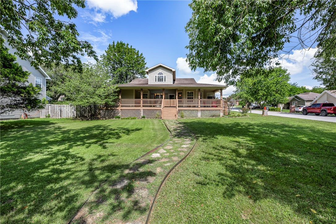 Just minutes from Beaver Lake access, this inviting 3-bedroom, 2-bath home offers the perfect blend of comfort and convenience. Relax on the expansive covered front porch (15 x 54) or enjoy peaceful evenings on the covered back porch. Situated on a spacious corner lot, the home features an open, welcoming layout ideal for everyday living or weekend getaways. Enjoy nearby boating, fishing, and outdoor recreation while still being close to town amenities.