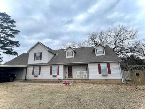 Beautiful custom two story home on 3.89 acres m/l. Newly painted and new six foot chain link fence across the back yard. Six foot wood privacy fence on both sides. Well maintained with room for pets and kids.  Master bedroom and 1 and 1/2 baths on the main floor. Two bedrooms and a bath on the second floor along with a bonus room for den, man cave, game room or office. Large two car attached garage with attached carport. Two HVAC units to accommodate both floors.