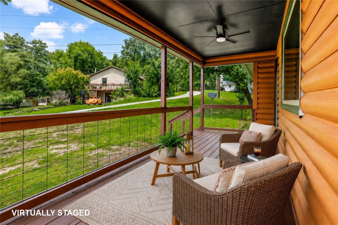 Whether it's weekends at the lake, evenings around the fire pit, or making this your everyday escape, this sweet lake-area home is ready for its next chapter.
This charming cabin-style home offers the perfect blend of comfort and convenience, just minutes from Beaver Lake and approximately one mile from War Eagle Marina. Whether you're searching for a peaceful weekend retreat, a full-time residence for lake lovers, or an investment opportunity, this property is ready to enjoy.
Relax on the inviting wraparound front and side deck, perfect for morning coffee or unwinding after a day on the water. The maintenance-free exterior and durable metal roof make ownership easy, while the .42-acre lot includes a storage shed and lean-to for all your lake accessories.
Inside, you'll appreciate the fresh updates, including interior paint, a new tub/shower combination, updated appliances, new light fixtures, and new hardware, creating a move-in-ready home with a fresh, welcoming feel.
