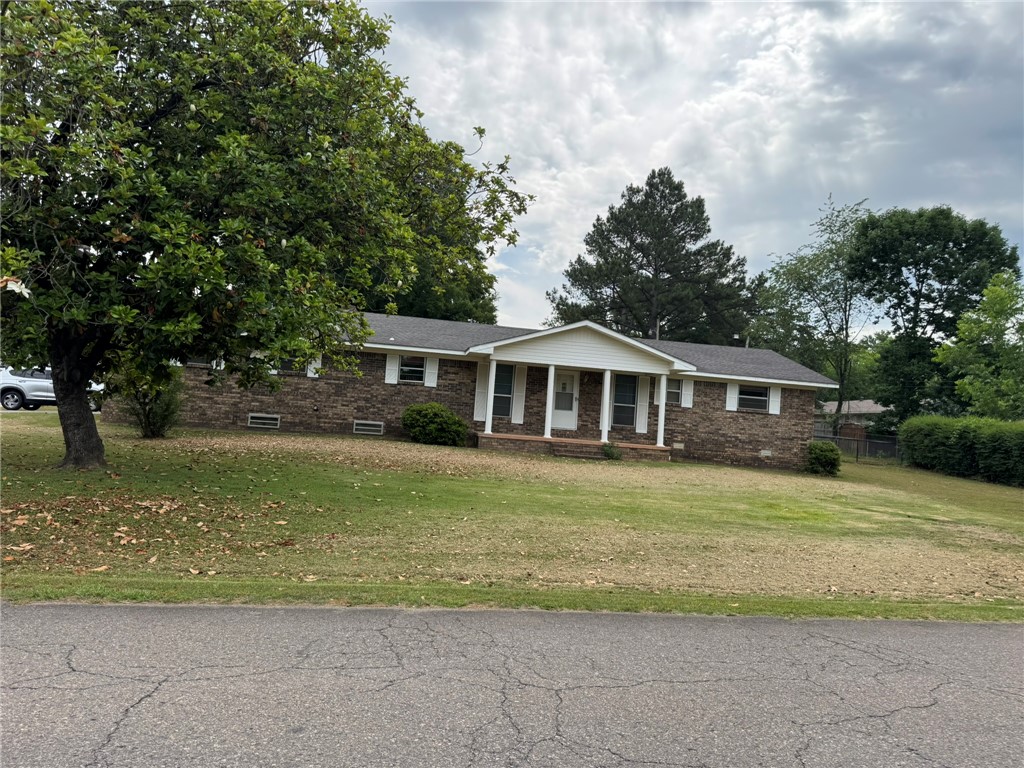 Welcome home to this 3 bedroom, 2 bath property located on N Frankfort in Russellville. This home features a large family room plus a separate living/dining area, offering plenty of space for entertaining or everyday living. Conveniently located with a functional layout and spacious living areas, this home is ready for you to make it your own.