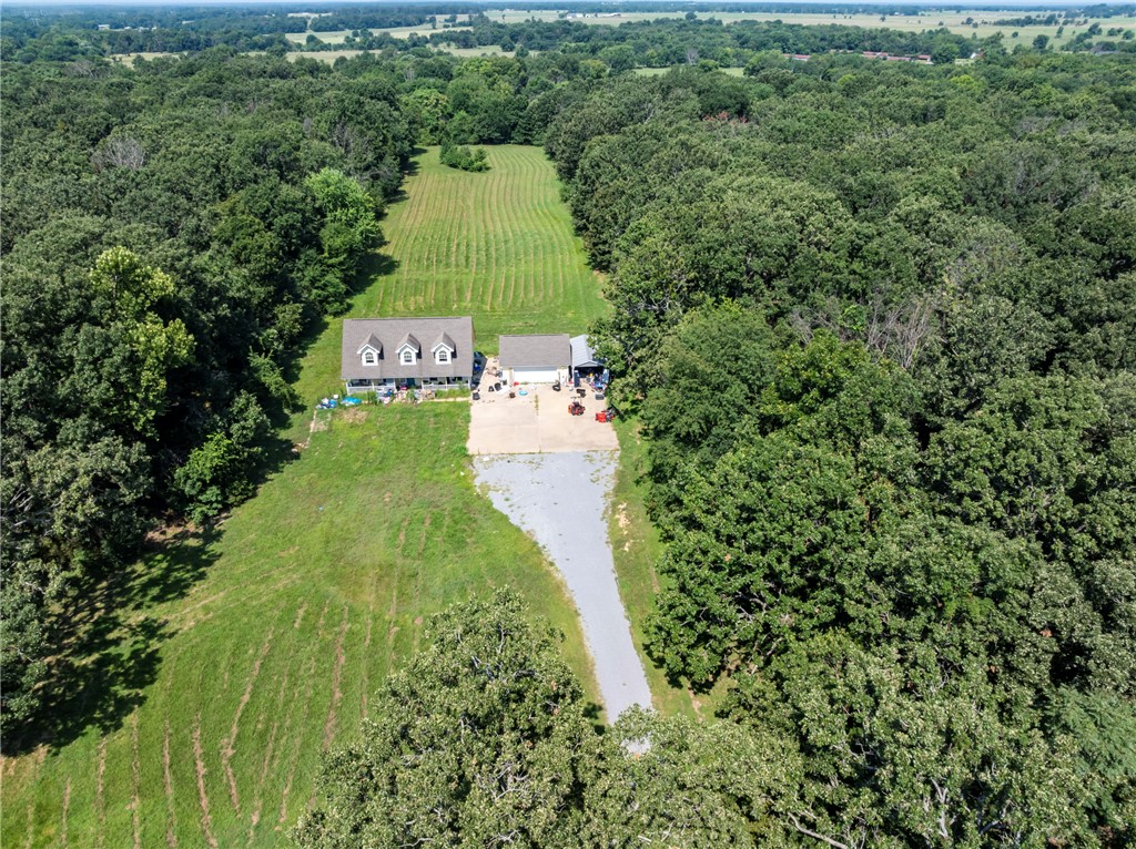 Secluded home near Swepco Lake offering a welcoming setting with privacy. The property features 8.41 acres with a pond. The home is almost 1,800 sq ft and offers 3 bedrooms and 3 full bathrooms with also a half bath. Ideal for buyers seeking a peaceful acreage property with being close to the lake while still be close to town. Home is Sold "AS-IS". The home did have a fire. It will need work to be done so it can be brought back to it's original elegance.