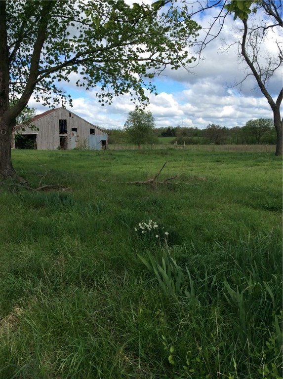 Development potential!!! Inside Bentonville city limits. Has water and natural gas on property. Frontage on Vaughn Rd and Motley Rd.