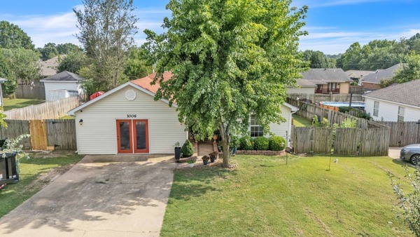 Welcome to this beautifully maintained 4-bed, 2-bath home featuring an inviting living space with thoughtful updates throughout. Enjoy the large master bedroom with a generous oversized walk-in closet & a custom-tiled shower in the ensuite bathroom. The cozy living room includes a gas fireplace & flows seamlessly into the eat-in kitchen, complete with oak cabinetry & plenty of space for dining. The garage has been converted into a versatile office space, ideal for remote work or a home studio. Step out onto the back deck, perfect for relaxing or entertaining & enjoy the fully fenced backyard. A storage building also conveys with the property. Conveniently located in Rogers, you’re just minutes from shopping, dining, & local amenities.