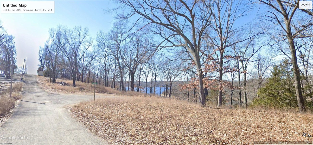 Very rare opportunity to purchase a buildable 3.0 acre Beaver Lake lot with west-facing lake view and walkable to lake front in desirable Panorama Shores Subdivision. 5 mins to Starkey Marina.
Lot offers unique configuration with relatively flat upper area corner on Panorama Shores Dr (1.25 acres MOL) and Shore Ln (switchback road to lake front). Lot also includes a second corner area (1/3 acre MOL) directly across the road from likely homesite, also on the same corner. And then two more tiered sections of the lot going down to the 100' lake front accessed by Shore Ln switchback which also provides access to a multi-slip boat dock and parking area. No boat dock included in sale.
Must visit and walk this very unique and appealing lot to fully appreciate. Survey available upon request.
PROPERTY IS AGENT OWNED.