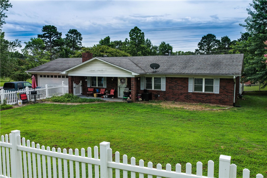 Nestled on a spacious .76-acre corner lot, 701 Hamilton Cove is the opportunity you have been waiting for! This 3-bedroom, 2-bathroom home offers 1,678 square feet of comfortable living space, an enclosed sunroom with an additional 259 square feet, an attached 2-car garage (576 square feet), and a large yard perfect for outdoor entertaining. Enjoy the best of both worlds, all the conveniences of in-town living without the in-town feel. This home offers a wonderful blend of space, comfort, and convenience. The expansive lot gives you the freedom to garden, entertain outdoors, or simply enjoy the open space that is increasingly hard to find. Enjoy the curb appeal that comes with a corner lot, plus the convenience of being just minutes from local parks, shopping, dining, and Interstate 40. Schedule your private showing today, This one will not last long!