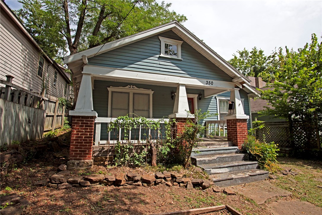 Craftsman style Charm, close to U Of A, Dickson St. The Square and all points Fayetteville, A 2 bedroom 1 bath home rare find waiting for new occupants! Real Hardwood floors! Includes Washer/Dryer & Refrigerator, also has built in dishwasher and Gas Cook Stove. Tile Kitchen counters and lots of cabinets, Large Privacy fenced yard, mature trees and lots of shade.