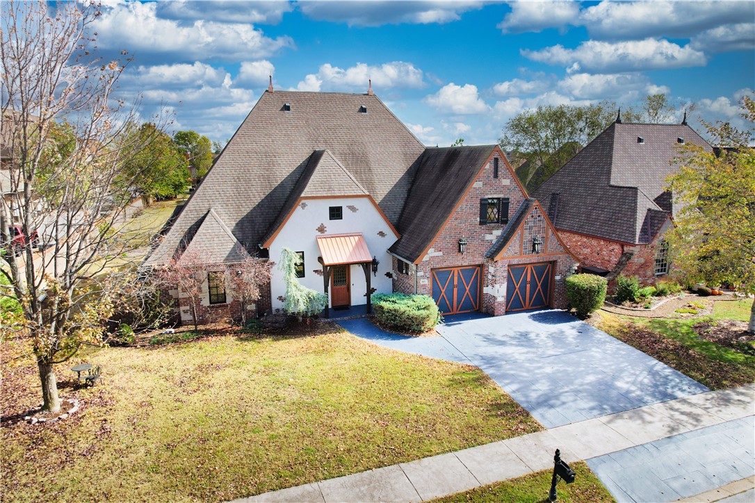 Minutes from Coler Mountain Bike trails and downtown Bentonville—this home places you in the heart of Northwest Arkansas’ most exciting lifestyle. This beautiful home is located in the Chardonnay Subdivision and near Elm Tree Elementary. Bike enthusiasts will love easy access to Bentonville’s world-class trail systems. Downtown Bentonville is a short drive away with award-winning restaurants, shopping, Crystal Bridges Museum of American Art, Walmart Museum, bike shops, and vibrant cultural attractions. Convenient access to SW 8th Street connects you to the new Walmart Home Office campus and the future 100-acre 8th Street Gateway Park. The home offers spacious living, high ceilings, and beautiful slate flooring in the main living space. A high-efficiency gas fireplace adds warmth and comfort. The kitchen provides abundant prep space for cooking and entertaining. Plus, the oversized primary suite features new engineered wood flooring and a spa-like bath. Enjoy Bentonville living from this beautifully located home!