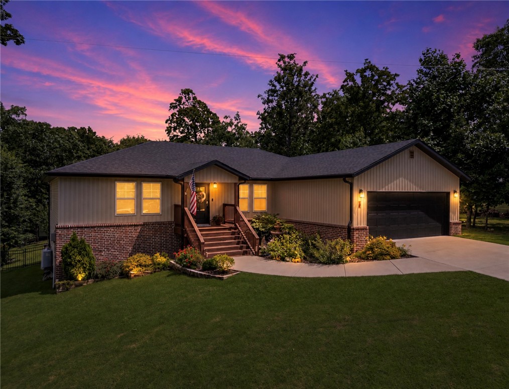 Welcome to your own private retreat. This beautifully appointed 3-bedroom, 2-bath modern Craftsman combines timeless finishes with a serene natural setting. Inside, you’ll find an open layout filled with natural light, quartz surfaces, designer lighting, custom millwork, luxury wood flooring, and a spacious kitchen designed for both everyday living and entertaining. The stunning primary bath showcases a freestanding soaking tub, oversized tiled shower, and dual vanity. Outdoors, the covered deck overlooks a fenced backyard, established landscaping, raised garden beds, fire pit area, and mature trees, creating a peaceful extension of the living space. A quiet oasis with modern conveniences just 3 minutes from Branchwood Recreation Center and the fire station, a few minutes farther to Loch Lomond marina, Lakepointe, the many golf courses, and all that Bella Vista has to offer!