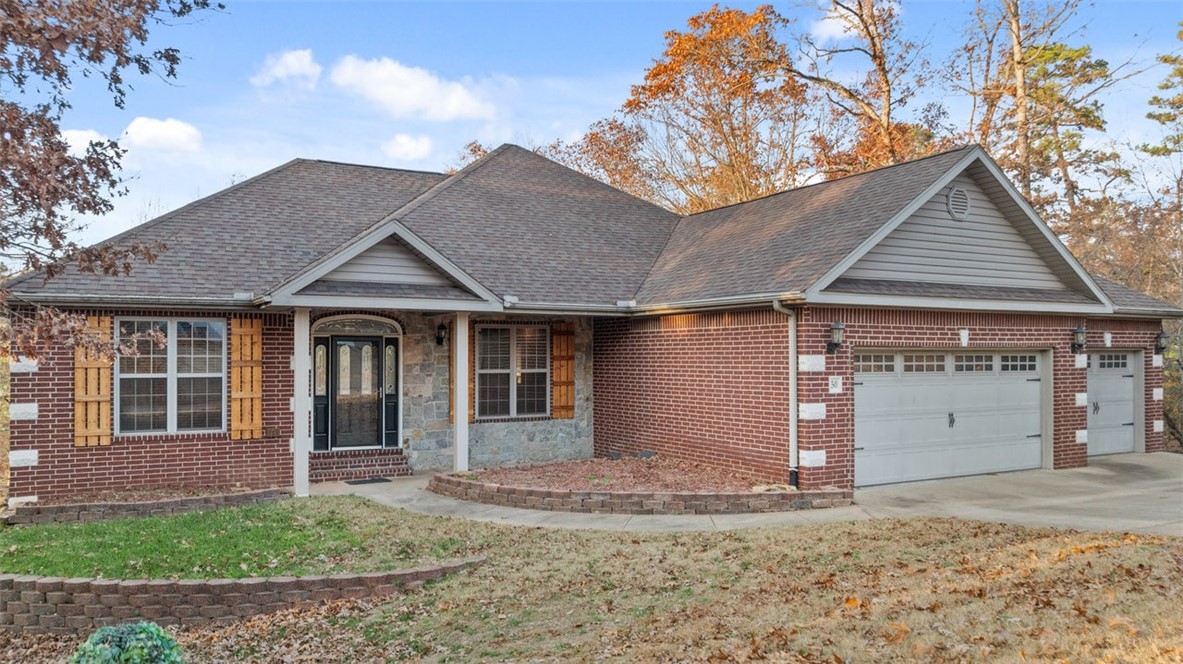 Welcome to this stunning 4-bed, 3-bath home with 3,548 s.f. of beautiful living space in Bella Vista’s scenic Lakenheath neighborhood! Amid mountain bike trails & just minutes from Lake Rayburn & Lake Ann, this home offers the perfect balance of comfort, style, & adventure. Step inside to find a bright, open main level featuring a formal dining, spacious kitchen with breakfast nook, three inviting bedrooms, two full baths, laundry room, & a covered deck perfect for relaxing or entertaining.
Downstairs, you’ll love the expansive family room with kitchenette, a private study, bonus room, craft room with custom cabinetry, dedicated office space, & another bedroom & full bath, all opening to a custom deck with built-in planters surrounded by nature.
Two beautiful stone fireplaces create warmth & character thruout, while a 3-car garage with sink & ample storage make this home as functional as it is beautiful.
Don’t miss your chance to own this exceptional Bella Vista retreat, where modern comfort meets Ozark charm!
