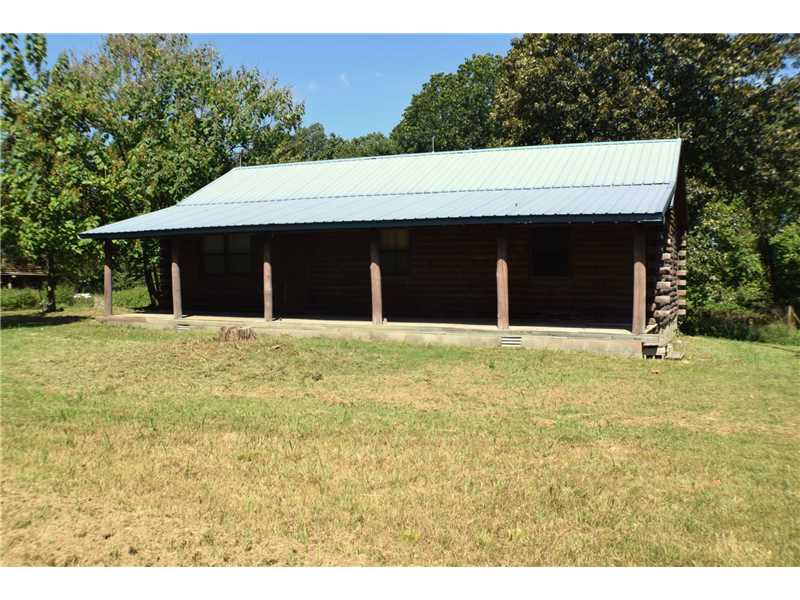 Ready to away from the busy city life. This is a Beautifully hand crafted log home on private acreage. Metal roof, covered front porch to relax on and watch children or pets play. New HVAC unit, Workshops, room for horses or gardens. Like to Fish? Prairie,Creek is only 30 min from the property. Also not far from hiking trails or War Eagle mill.