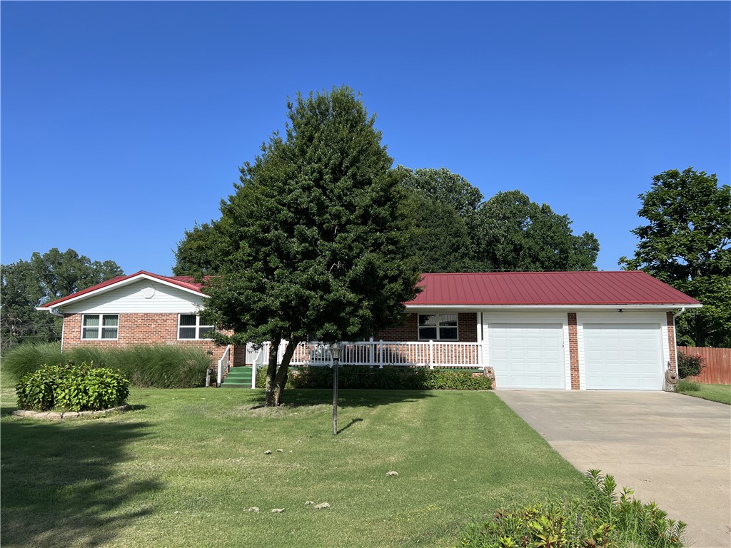 Move-in-ready 3BR-2BA brick and vinyl home with 2,216 SQFT on 0.40 acre m/l!! This updated home features 2 living rooms, large laundry room, gas fireplace, 2 wheel-chair ramps, sliding barn doors, 2 car garage, two storage buildings measuring 30'x11' and 12'x13', and a wood privacy fence backyard.  Lots of upgrades in the recent years include windows, PEX plumbing, electric, metal roof (2021), gutters with leaf guard, HVAC (2023), dishwasher (2024), electric range (2021), and much more. Located outside of town about 5 minutes from downtown Harrison.