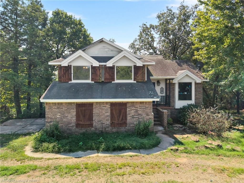 Move-in ready country home on a beautiful piece of land — just needs a little TLC to really shine! Updated kitchen with granite, rock backsplash, and stainless appliances. Finished walk-out basement with safe room, plus multiple decks to enjoy those million-dollar views. Outside, enjoy a pond, greenhouse, fruit trees, 26x50 metal shop w/ concrete floor & 5 horse stalls, all on a beautiful 14.15 acres surrounded by amazing views. About 6 acres fenced and ready for your animals or projects. So much potential here — bring your finishing touches and make it your own!
