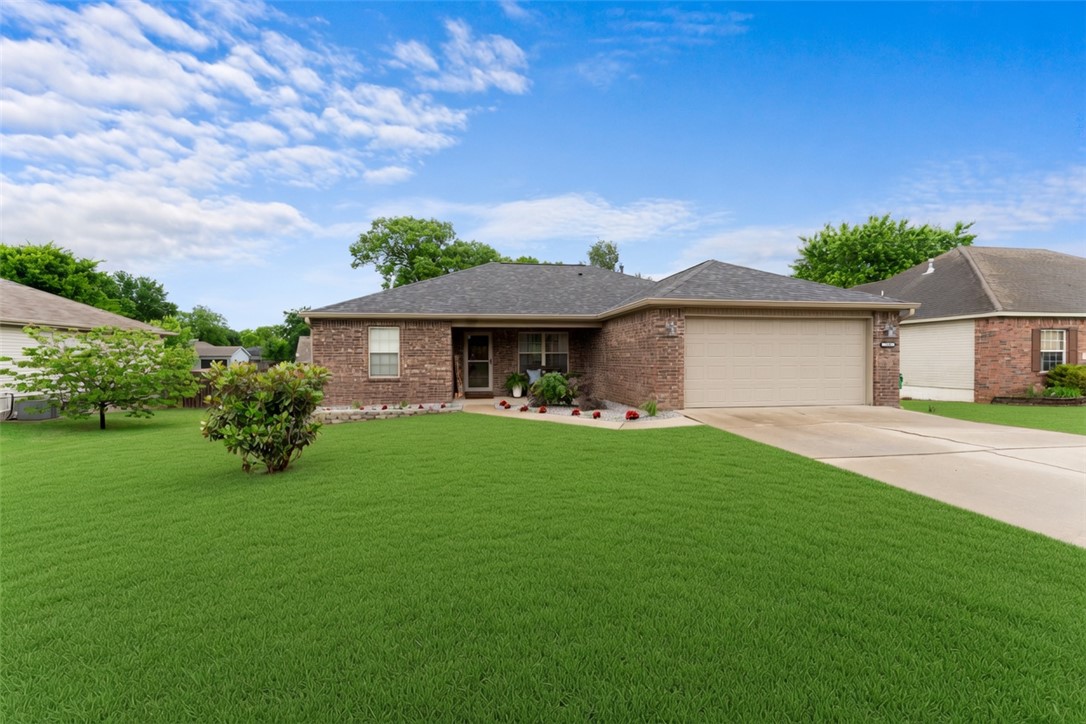 Welcome home to this pristine, move-in-ready, one-level sanctuary featuring a bright, open floor plan perfect for modern living. The spacious living room welcomes you with soaring vaulted ceiling, durable LVP flooring, and an abundance of natural light. Culinary enthusiasts will love the kitchen, which boasts granite countertops, a pantry, stainless steel appliances—including a brand-new range and dishwasher—and a charming eat-in area accented by a stylish feature wall. Retreat to the generous primary suite complete with LVP flooring and a spa-like ensuite bath featuring double sinks, a tub/shower combo, and a walk-in closet, while two additional large bedrooms feature plush new carpeting. Recent 2025 updates offer ultimate peace of mind, including a new roof, water heater, garage door, landscaping and a built-in EV charger in the garage. All of this sits on a fantastic lot where you can relax on the back deck and overlook your massive, fully fenced backyard!