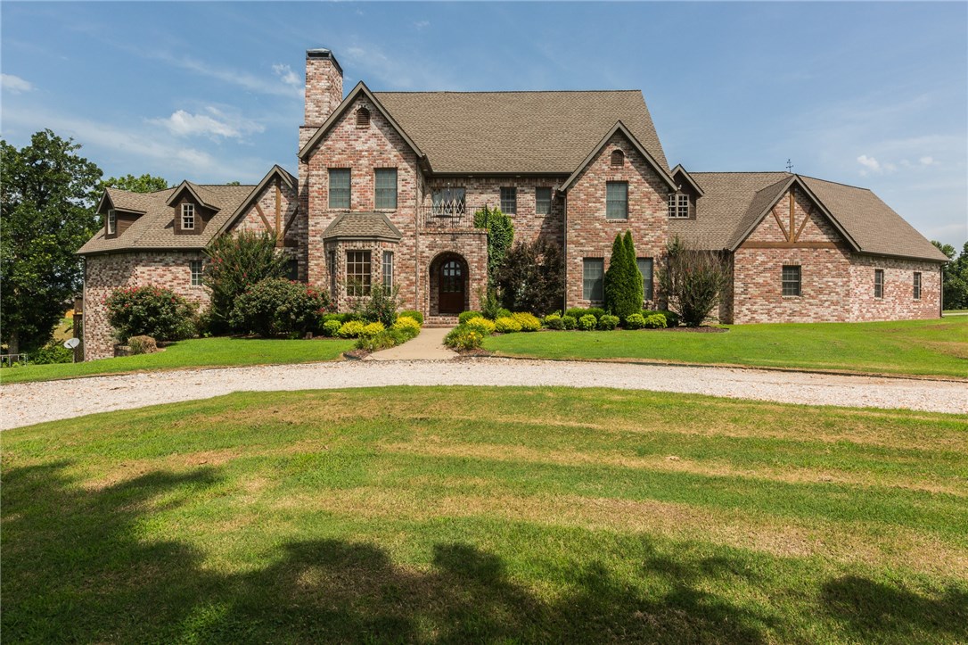 High end luxury estate on 7.5 acres of open pasture, custom built by Homes of Distinction. Absolutely stunning chateau style home, surrounded by mature trees. Kitchen features state of the art GE Monogram appliances, pot filler & honed granite tops, plus eat in kitchen area bathed in natural light. Family room features soaring beamed ceilings & custom built-ins. Regal dining room off the entry & gorgeous study with wood burning fireplace. Show stopper master bath w/ travertine floors. Bonis room upstairs