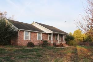 Wonderful opportunity with this spacious brick home on near level 6.18 acres m/l with open floor plan, partial covered back deck, barn & much more. All #'s are approx., age is estimate, sq. footage per assessor, buyer to verify existence of septic.