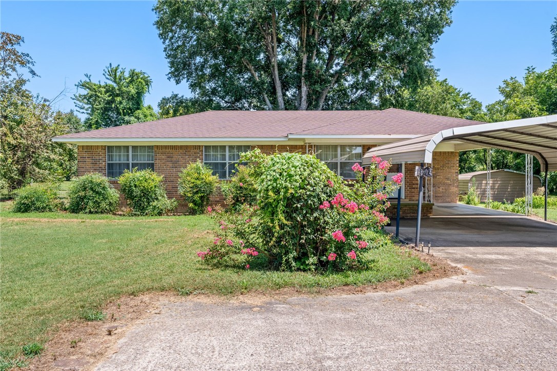 Positioned in a high-convenience location with fast, easy access to Interstate 40, this versatile property offers over 4 acres of pristine Mulberry real estate! Featuring a classic 1975-built home, this site combines peaceful country charm with unbeatable potential for commercial rezoning. The acreage features a beautifully maintained yard anchored by grand, mature pecan trees providing excellent curb appeal, natural shade, and a picturesque backdrop. Premium structural peace of mind comes ready with a complete new roof installed in 2023 on this 3BR/2BA brick home with an open floor plan to gather family and friends. Whether you're looking for a spacious home base with room to spread out, or seeking an ideal location with prime commercial growth opportunities subject to rezoning, this unique property is ready for your vision. Schedule your private showing today to explore the possibilities!
