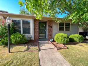 Location, easy living, low maintenance...sounds great, doesn't it?! This 2 bedroom, 2 bathroom condo at White Oak is calling your name!  Features include wood vinyl and tile flooring throughout, a spacious master suite complete with ensuite bath, one car garage, lovely kitchen and a fenced in back yard. The condo HOA is $60 per month and includes the swimming pool, use of the clubhouse and your lawn will be mowed!  Just imagine; no mowing! White Oak Condos are the only condo association in Harrison that includes a swimming pool for you to use! You will love the condo way of life!