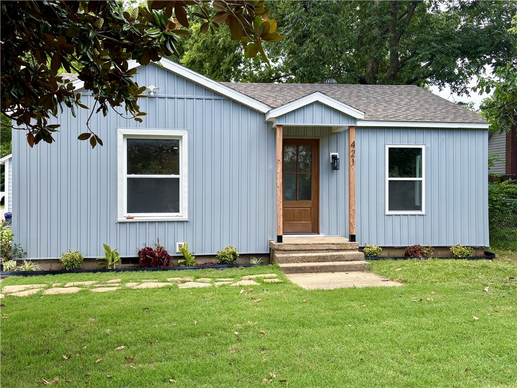 Introducing this charming little blue dollhouse- where timeless charm meets upscale design and custom craftsmanship. Completely transformed from the ground up, this one-of-a-kind home blends character, quality, and modern convenience.

Step inside to a fully renovated interior featuring plumbing (including sewer and yard lines), electrical, central HVAC, and water heater. The exterior has also been refreshed with new siding and a new roof.

The redesigned floor plan offers a spacious laundry/mudroom, oversized pantry, and primary walk-in closet—rare features in a home of this size. Luxury waterproof vinyl flooring flows throughout, complemented by custom cabinetry and elegant tile in the wet areas. This bright 2-bedroom, 1-bath home is truly move-in ready.
Outside, enjoy a detached garage for parking or storage and a spacious yard perfect for kids, pets, or relaxing evenings. Located within walking distance of downtown Siloam Springs, you’ll love the convenience of nearby shops, restaurants, and local charm.