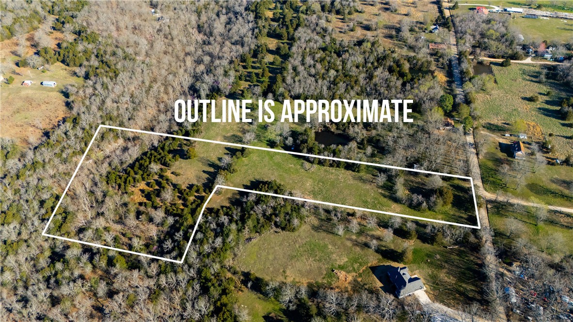 This 9.04-acre property offers the perfect blend of peaceful countryside living and convenience. Located in the countryside of Prairie Grove, this land is just 2 miles from the heart of town and only about 15 minutes to Fayetteville. With water and electricity readily available, you can start your project without delay. The property is mostly cleared, making it an ideal location to build your dream home. Towards the back of the property, a charming creek runs through, adding a tranquil, natural element to the landscape—perfect for relaxing by the water or enjoying the peaceful sounds of nature. No covenants or restrictions, giving you the freedom to design and use the property as you see fit. Whether you’re looking for a private country retreat, a place to build your forever home, or room for additional structures, the possibilities are endless. Survey available.