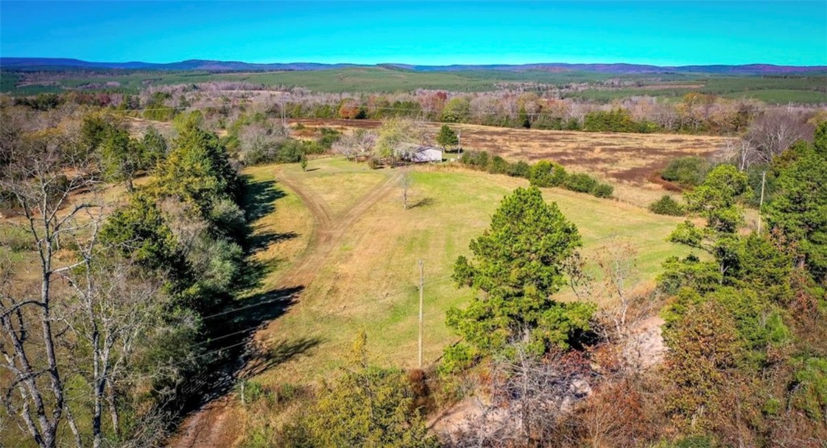 Escape to peaceful country living with this spacious 3-bedroom, 2-bath mobile home situated on 79.84 acres of beautiful farmland! Inside, you'll find an open-concept layout featuring a modern kitchen with a large island and an oversized walk-in pantry. The primary suite is designed for comfort with double vanities, a walk-in shower, a relaxing soaking tub, and a spacious walk-in closet. Additional features include a storm shelter, whole-home generator, and endless possibilities for farming, recreation, or outdoor living. Don’t miss this perfect combination of comfort, privacy, and opportunity!