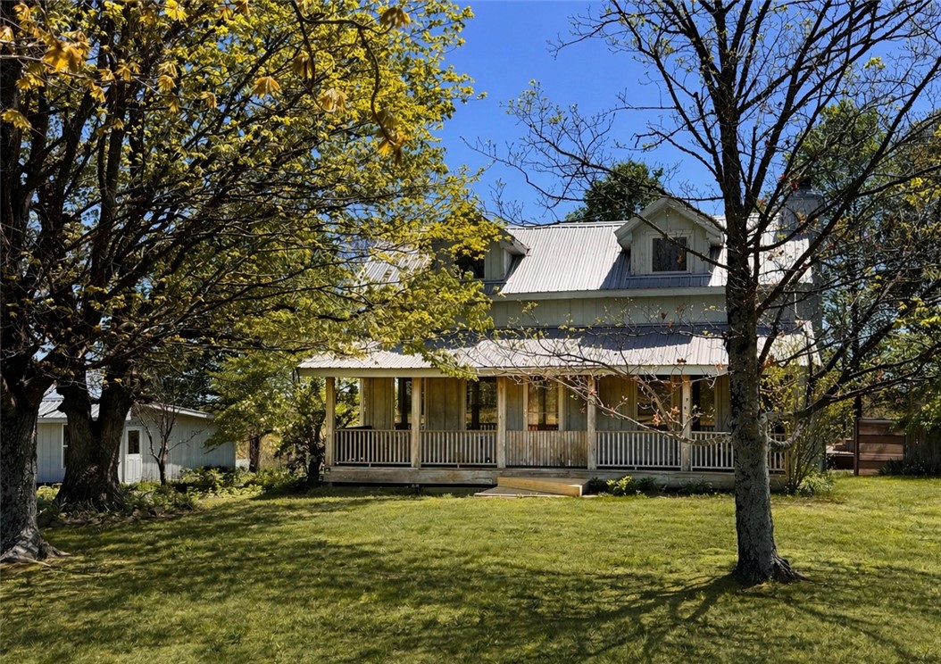 Horse lovers—this property is ready for you and your horses. Located at 9716 Borland Ln in Boone County, just minutes from the Newton County line on Hwy 43, this property sits in the heart of the Buffalo National River area near excellent horseback riding and hiking trails.

The land features open pasture, a pond, and multiple barns with stalls, wash areas, and tack rooms, making it easy to move in and start enjoying your horses right away. The barns also offer plenty of storage for trailers, ATVs, and outdoor recreation equipment.

The home offers classic country charm with large shade trees in the front yard and a spacious front porch perfect for relaxing and visiting with friends and family.

A large three-car garage with a workshop area provides room for tools and projects.

Conveniently located just minutes from Harrison for shopping, dining, and everyday essentials, this property offers the perfect blend of horse-ready infrastructure, recreation, and comfortable Ozark country living.
