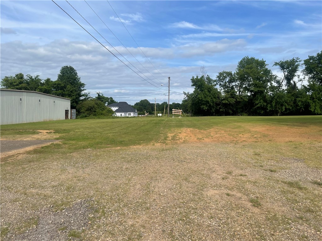 A prime commercial lot positioned in the heart of a thriving business corridor, surrounded by well-established retailers, professional offices, and popular eateries that generate consistent daily traffic. The property benefits from excellent visibility, strong street presence, and easy access from major roads, making it ideal for retail, restaurant, office, or mixed-use development. Nearby dining options and long-standing businesses create a vibrant commercial atmosphere that attracts both local residents and visitors throughout the day. With neighboring enterprises already drawing steady customer flow, this lot offers exceptional potential for growth, exposure, and long-term investment value.