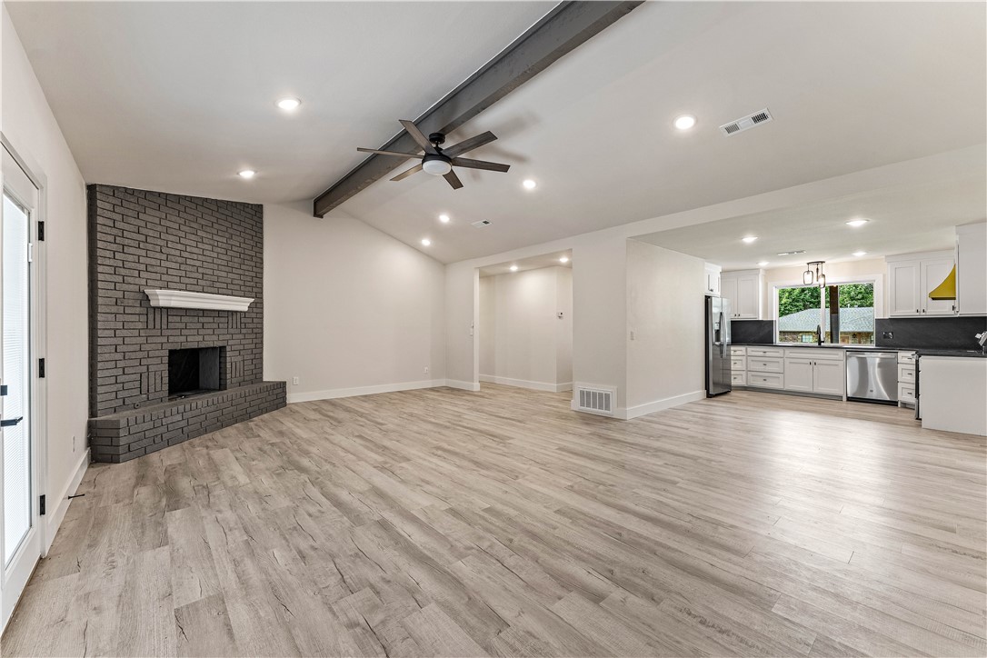 Welcome to this fully renovated home in Turtle Creek Subdivision. Thoughtfully redesigned with an open, bright layout, this home offers stylish finishes throughout. The spacious living room is anchored by a brick gas fireplace and recessed lighting, while flowing seamlessly into the kitchen, where a large window above the sink fills the space with natural light, complementing the granite backsplash and surfaces. A former office has been converted into a true fourth bedroom, located near the dedicated utility room with exterior access to the backyard and garage. An additional parking area in the front provides extra convenience. Both bathrooms feature fully tiled walk-in showers and granite surfaces, while the primary includes its own private ensuite. 2 car garage with zero entry and home is on one level with wide hallways. The covered patio extends your living space outdoors and overlooks a fully fenced backyard. Located just minutes from Lake Atalanta, scenic walking & biking trails, schools, shopping and dining.