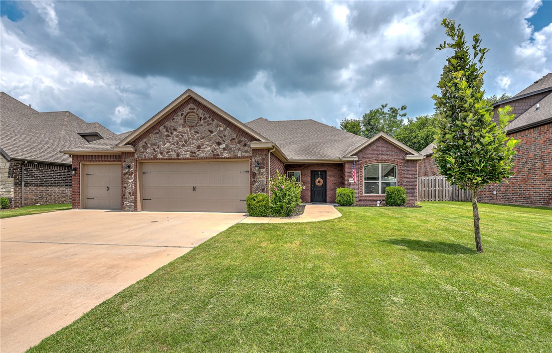 Lovely 3 bed, 2 bath home in the wonderful Willowbrook Farms Neighborhood. You will be wowed by the details around every corner, from the dark hardwood floors and stunning tilework to the gorgeous custom carpentry throughout, including crown molding, trim work, and oak cabinetry. Perfect for entertaining friends and family, the large living area and eat in kitchen provides tons of space and seating for dinner parties, then leads onto a relaxing covered patio overlooking a large fenced in backyard. Stay in for movie nights in the bonus room. This home provides plenty of amenities including central vacuum, wired for sound, security system, tons of storage and storm shelter. You are 1 mile to the Walmart Distribution Center, within 3 miles to the Bentonville Community Center, hiking and biking trails, and multiple schools, plus a quick 15 minute drive to the Northwest Regional Airport.