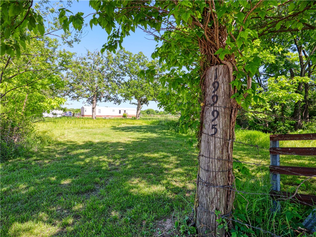 Looking for an affordable full-time residence or a comfortable place to live while you build your dream home on the same land? This property checks all the boxes. Nestled on 1.65 beautiful acres, this move-in-ready 2-bed 2-bath home offers the perfect blend of comfort, space, and opportunity. 20x10 storage shed and fenced back yard. With mostly flat terrain and a wonderful mix of mature trees and open land, the property feels like a private retreat while staying just 10 mins from downtown Siloam Springs.