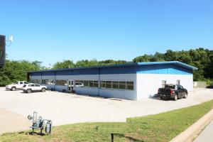 7,200 sqft Tyler brand ''red steel'' commercial building on one of the busiest streets in Harrison, AR. 3,500 sqft of retail space and 3,000 sqft warehouse. 15' walls in the warehouse area and 10' ceiling in the showroom.  2 loading docks and a 13' high overhead door. Daily traffic count of in front of the property is 8,900 (AHTD 10/2014). http://tylerbuilding.com