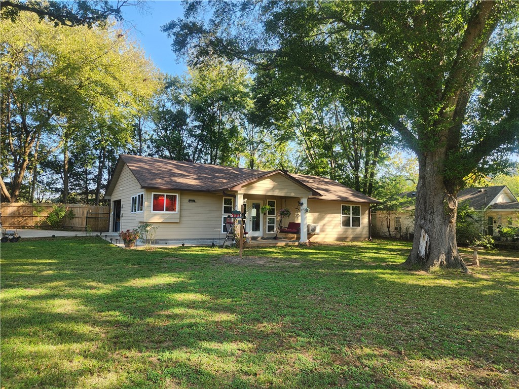Country Comfort outside and Cowboy Chic inside, this custom-built home is charmingly unique! Quality built for their personal home by experienced Builders, this one has everything you need! From the wood interiors, the tile floors, sliding pocket doors and so many other custom touches, this home pleases in every way. The beautiful kitchen offers custom built hickory cabinets, a large island make this kitchen a joy to work in! The Primary suite offers a great bath and a huge walk-in closet! Enjoy the outdoors with a huge shaded lot, great privacy area in back with open patio, covered deck and hot tub. Completely fenced front and back, this home includes an attached garage, and with shop and 300 amp service, RV hookup and dump station, and so much more! Enjoy the huge oak trees, the beautifully landscaped yard, and lots of room to enjoy! Call today to schedule your showing.