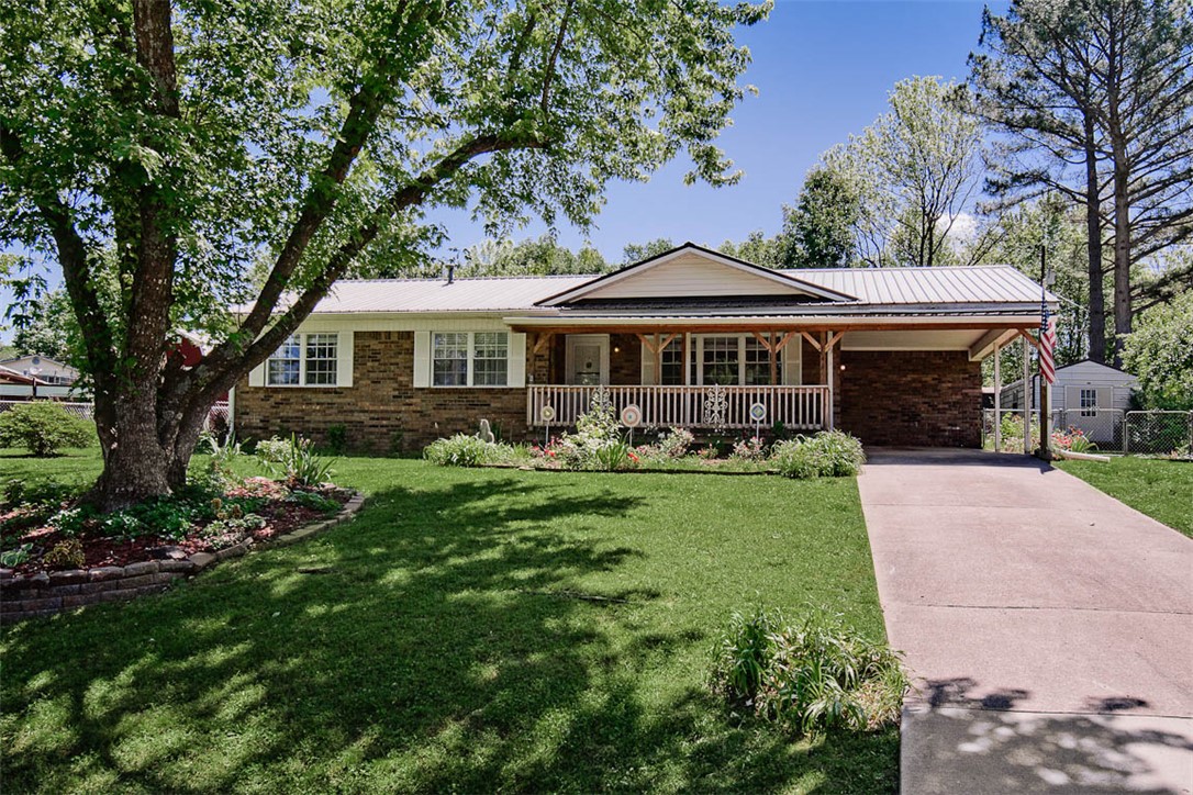 AWESOME Starter Home in quaint, West Fork neighborhood at 43 Elmwood ST. 10 Min Drive to Fayetteville and U of A. Wonderful canvas for creating your ideal small-town lifestyle (or family-owned student housing). 1975 Built with MANY updates. The lot is 0.41-acre, home is a 1,316 SF with 3 bedrooms, a full bath, and a half bath. A roof-shaded front deck provides for relaxing in the mornings or afternoons. Fenced Backyard features 2 structures: a 200 SF "SHOP capable" & 80 SF Storage.  A backyard fire pit for night gatherings. Well-maintained with a LOADS of upgrades: METAL ROOF, Lifetime Leaf Guard Warranty, modern vinyl plank flooring, Double-Pane Tilt vinyl windows throughout, Crown Molding, modern Kitchen appliances, GAS INSTANT HOT WATER HEATER, under-cabinet lighting, Custom Glass Backsplash, Lower Kitchen Cabinet w/PULL OUT SHELFS. All appliances, Washer & Dryer, and Refrigerator MAY convey with an acceptable offer. Current HVAC seasonal check-up. Home warranty MAY be negotiable. FHA/VA/RD, or CONVENTIONAL,