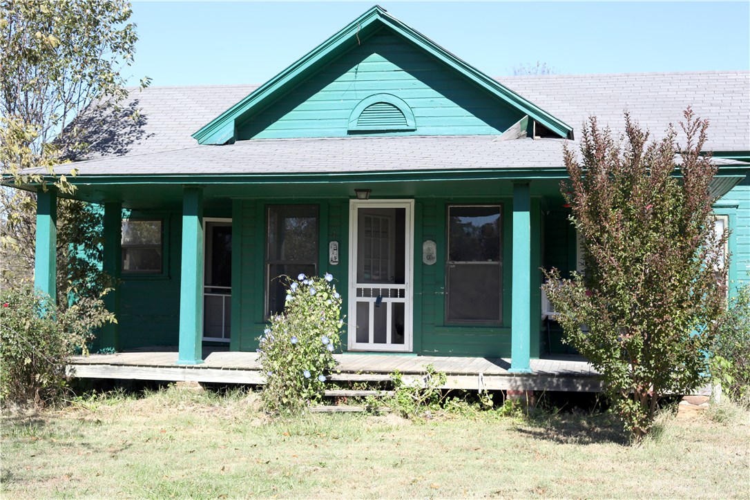 This property has been subdivided, and all title issues have been resolved. It is an excellent property for development. Can be developed as a multi family community, or build 5 homes and sell. River area can be cleared and used as recreation. The house is old, needs a lot of updating, and the property is sold as is. No repairs will be made. Please note, the electrical system is a fuse system, not breakers. There is a lot of value in this property. Please take some time to check out the options.
