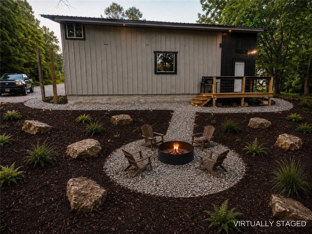 Welcome to your cozy cabin retreat at 20619 Wade Rd, Springdale, AR 72764! This charming 2-bedroom, 1-bathroom home sits on a private, wooded 0.5-acre lot with no covenants, making it perfect for those seeking freedom and space – livestock welcome! The cabin features a durable metal roof and siding, while the interior blends modern and rustic elements for a warm, inviting feel. Features include a comfortable loft with one-bedroom and one bedroom and bathroom on the main level and has convenient stackable washer and dryer. Property created to impress with vaulted ceilings that enhance the open atmosphere. Three mini-split units provide efficient heating and cooling throughout the year.
Enjoy public water access and a reliable septic tank system. For added peace of mind, this property comes with a transferable home warranty. Experience ultimate privacy and the serene beauty of nature in this unique Springdale cabin in the woods!